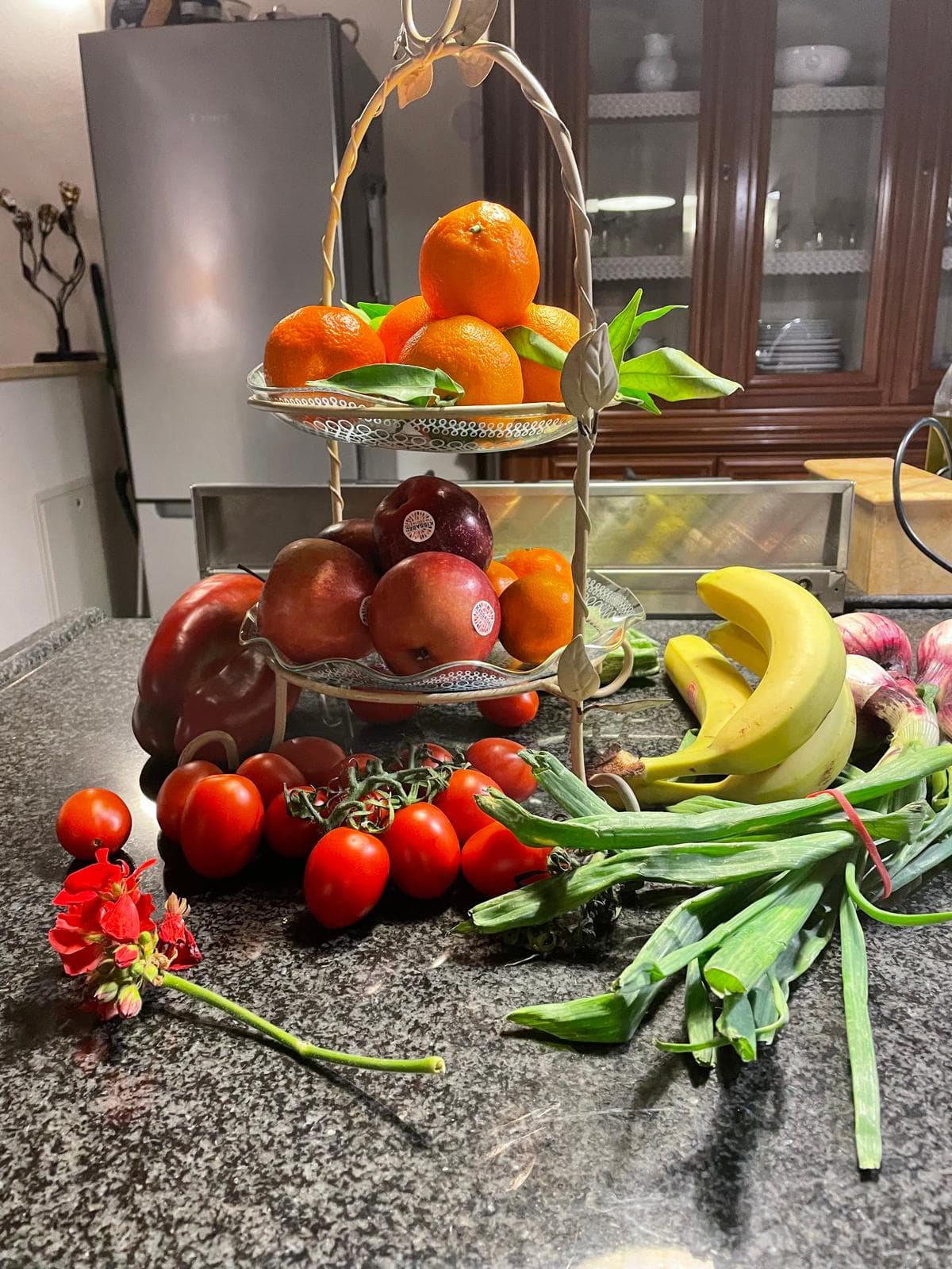 Kitchen island with fresh produce under glass pendant lights